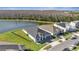This aerial shot features the home's location near a pond in a well-maintained residential area at 1130 Pando Loop, Orlando, FL 32824