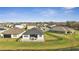 This aerial view features a home with a fenced backyard and a paved patio with outdoor seating at 1130 Pando Loop, Orlando, FL 32824