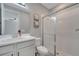 Clean bathroom features a shower with sliding glass doors, a white vanity, and a neutral color scheme at 1130 Pando Loop, Orlando, FL 32824