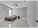 Bedroom with gray walls, gray tile floors, and a black ceiling fan at 1130 Pando Loop, Orlando, FL 32824