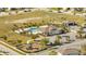 Aerial view of community pool, clubhouse, playground, and ample green space at 1130 Pando Loop, Orlando, FL 32824