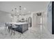 Modern kitchen island features pendant lighting and seating with stainless steel appliances at 1130 Pando Loop, Orlando, FL 32824