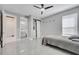 Bright main bedroom features a ceiling fan, closet, and ensuite bathroom with modern fixtures at 1130 Pando Loop, Orlando, FL 32824