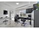 Home office with bright light, large windows, desk, and built-in cabinets, perfect for remote work at 1130 Pando Loop, Orlando, FL 32824