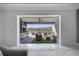 Outdoor living space with comfortable seating area, outdoor kitchen, and lake views, perfect for relaxing at 1130 Pando Loop, Orlando, FL 32824