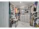 Spacious walk-in closet featuring custom shelving, drawers and hanging rods for maximum storage and organization at 1130 Pando Loop, Orlando, FL 32824