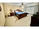 Cozy bedroom with plush carpet, stylish furniture, and soft, natural lighting at 1201 Providence Blvd, Kissimmee, FL 34744