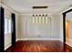 Dining Room with wood floors, shuttered window, and modern chandelier at 1201 Providence Blvd, Kissimmee, FL 34744