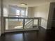 Upstairs hallway with glass railings offering a clear view of the lighting fixture and foyer at 1201 Providence Blvd, Kissimmee, FL 34744