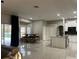 Expansive open-concept kitchen with island, breakfast nook, modern appliances and natural light at 1201 Providence Blvd, Kissimmee, FL 34744