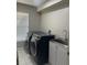 Laundry room featuring a washing machine, dryer, and utility sink at 1201 Providence Blvd, Kissimmee, FL 34744