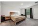 Spacious bedroom featuring a comfortable bed, modern furnishings, and a dedicated workspace area at 151 Flatfish Ct, Poinciana, FL 34759
