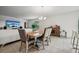 Open dining area featuring a wooden table, stylish chairs, and great views of the living space at 151 Flatfish Ct, Poinciana, FL 34759