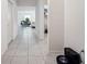 Hallway with tile floors leads to living area at 151 Flatfish Ct, Poinciana, FL 34759
