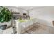 Bright kitchen features stainless steel appliances and island seating at 151 Flatfish Ct, Poinciana, FL 34759