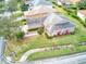 Aerial view of a house showing the landscaping and proximity to neighborhood homes at 153 Ventana Dr, Poinciana, FL 34759