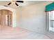Empty bedroom with a spacious layout, carpeted floors, and ample natural light at 153 Ventana Dr, Poinciana, FL 34759