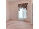 Cozy bedroom with pink carpet, a bright window, and neutral walls at 153 Ventana Dr, Poinciana, FL 34759