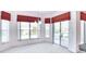 Bright dining area with large windows and sliding glass doors to the outdoor patio at 153 Ventana Dr, Poinciana, FL 34759