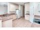 Bright kitchen with white cabinets and tile flooring; spacious and functional design at 153 Ventana Dr, Poinciana, FL 34759