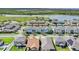 Aerial view of townhomes near a lake with green spaces and community amenities at 1578 Softshell St, St Cloud, FL 34771