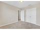 Cozy bedroom with neutral carpet, double door closet, and ample natural light at 1578 Softshell St, St Cloud, FL 34771