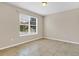 Bright bedroom with tile flooring and a window offering natural light at 1578 Softshell St, St Cloud, FL 34771