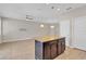 Kitchen island with granite countertop, dark cabinets, and pendant lighting at 1578 Softshell St, St Cloud, FL 34771