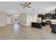 Spacious open floor plan featuring a modern kitchen with stainless steel appliances and tile flooring at 1578 Softshell St, St Cloud, FL 34771