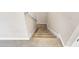 Carpeted staircase providing access between floors, perfect for a multi-level home design at 1578 Softshell St, St Cloud, FL 34771