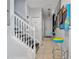 Hallway with arcade games and a staircase, providing entertainment and access to different levels at 1717 Retreat Cir, Clermont, FL 34714