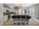 Kitchen featuring an island with seating, white cabinetry, stainless steel appliances, and natural lighting at 1717 Retreat Cir, Clermont, FL 34714