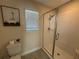 Updated bathroom showcases a glass enclosed shower, neutral wall colors, and modern fixtures at 199 Macaulays Cv, Haines City, FL 33844