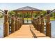 Picturesque gazebo overlooking the water, offering a peaceful retreat with beautiful waterfront scenery at 199 Macaulays Cv, Haines City, FL 33844