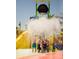 Fun-filled community water park with interactive features, slides, and a splash bucket for Gathering enjoyment at 199 Macaulays Cv, Haines City, FL 33844