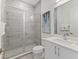 Modern bathroom featuring a glass-enclosed shower and elegant vanity at 2117 Pine Oak Loop, Davenport, FL 33837