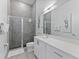 Modern bathroom with a glass shower, bright vanity, and neutral decor at 2117 Pine Oak Loop, Davenport, FL 33837