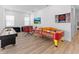 Spacious game room featuring Pac-Personal air hockey table, a TV and a seating area for entertainment at 2117 Pine Oak Loop, Davenport, FL 33837