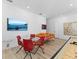 Entertaining game room with a Pac-Personal table, glass-top table with seating, and a view of the TV at 2117 Pine Oak Loop, Davenport, FL 33837