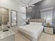 Inviting main bedroom boasts an ensuite bathroom and modern decor at 2117 Pine Oak Loop, Davenport, FL 33837