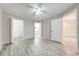 Spacious bedroom features neutral walls, wood-look flooring, and a ceiling fan at 2210 Yankee Pl # 334, Orlando, FL 32839