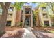Condo exterior with brick and siding, balconies, stairwell, and surrounding trees at 2210 Yankee Pl # 334, Orlando, FL 32839