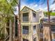 Attractive condo building with two levels and balconies nestled among the trees at 2210 Yankee Pl # 334, Orlando, FL 32839
