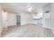 Open living room with neutral walls, wood floors, and a ceiling fan at 2210 Yankee Pl # 334, Orlando, FL 32839