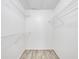 The walk-in closet includes wire shelving and hard surface floors at 2210 Yankee Pl # 334, Orlando, FL 32839