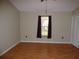 Bedroom boasts laminate floors, a window overlooking the yard, and closet at 2235 Emperor Dr, Kissimmee, FL 34744