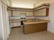 Bright kitchen with modern appliances, countertops, and ample cabinet space at 2235 Emperor Dr, Kissimmee, FL 34744