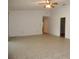 Open living room featuring neutral tile floors, white walls and ceiling fan at 2235 Emperor Dr, Kissimmee, FL 34744