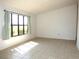 Spacious living room with tile floors, a large window, and natural light at 2235 Emperor Dr, Kissimmee, FL 34744