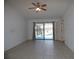 Living room features sliding glass doors with access to the lanai and pool at 2235 Emperor Dr, Kissimmee, FL 34744